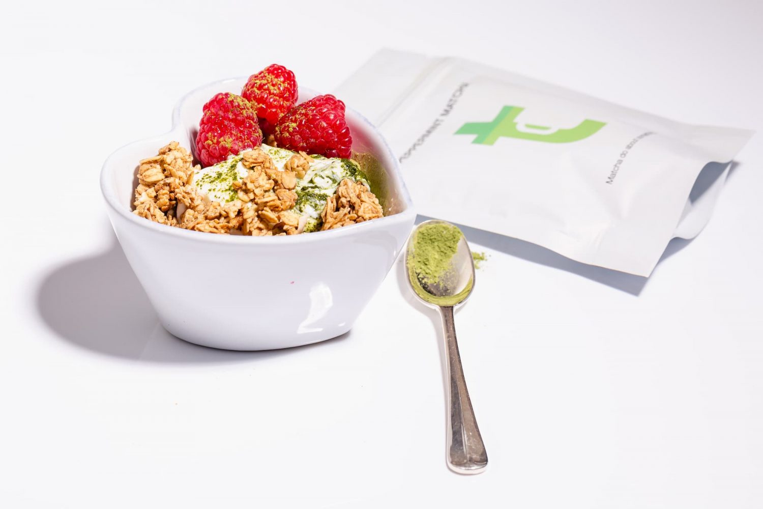 A breakfast bowl with a sachet of Twist Teas matcha next to it, showing the may ways one can incorporate matcha into their food and drinks for a lovely experience.