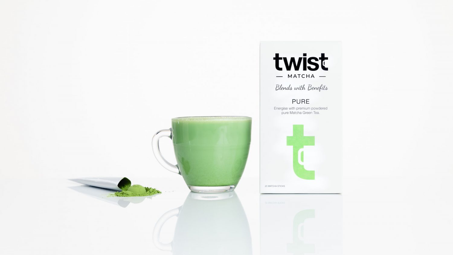 A recommended pure Twist Teas Matcha Carton and sachet, placed either side of a Matcha latte.